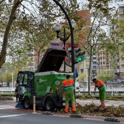 Slide 65: City workers clean up after a wind storm with mini-truck